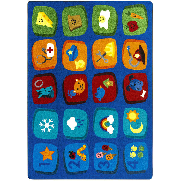 A white rectangle area rug with blue, red, and yellow squares containing numbers and letters.