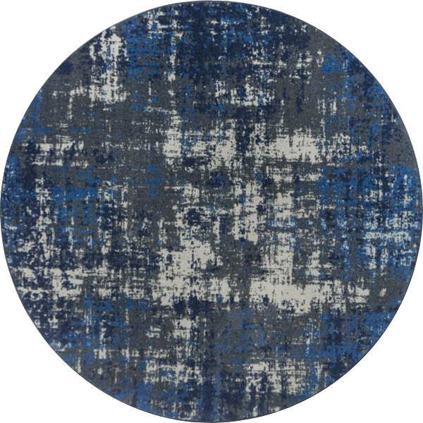 A Joy Carpets round blue and white area rug with a circular pattern.