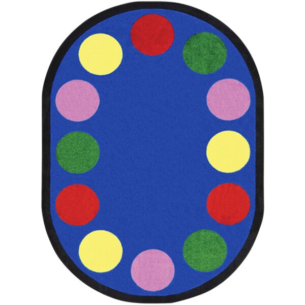 An oval multicolored rug with colorful circles in a room.