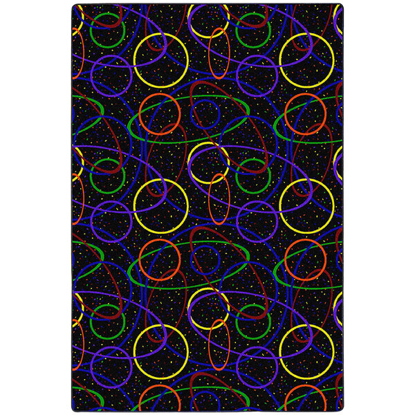 A black area rug with colorful circles on it.