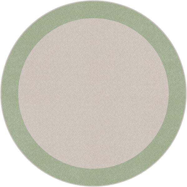 A white circular rug with a green border.