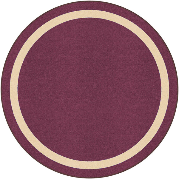 A round beige area rug with a purple center and white border.