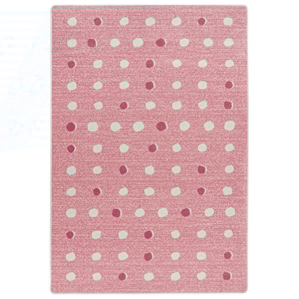 A pink and white rug with white dots.