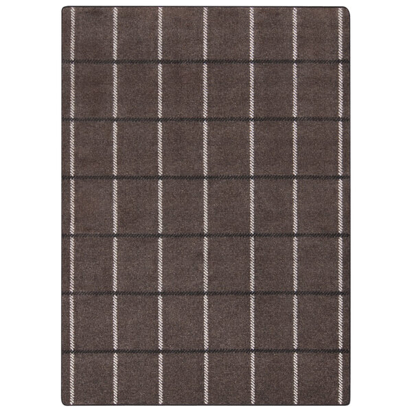 A close-up of a brown and white plaid Joy Carpets rectangular area rug.
