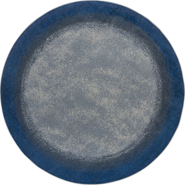 A round blue and grey Joy Carpets area rug.