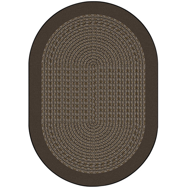 A close up of a brown oval rug with a white center.