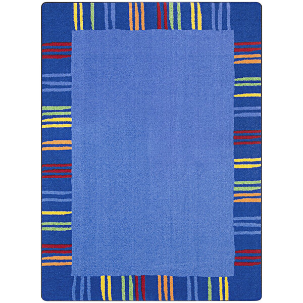 A blue area rug with multicolored stripes.