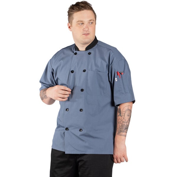 A man wearing a Uncommon Chef Havana short sleeve chef coat.