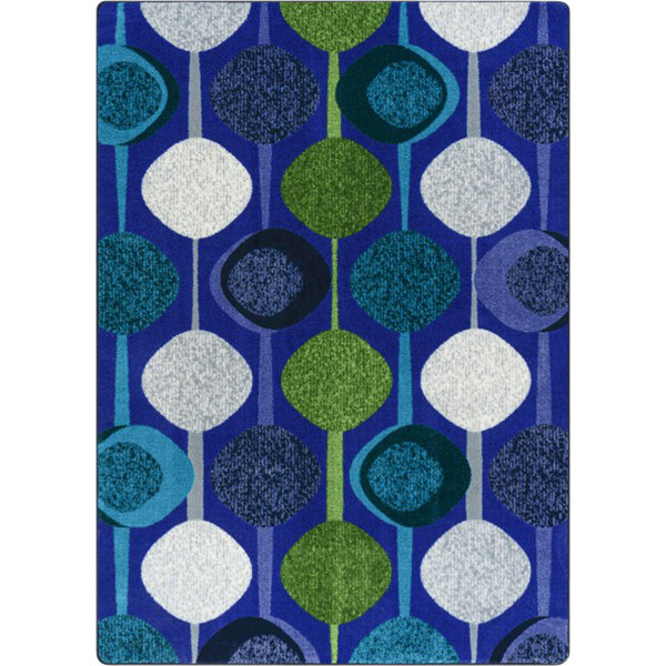 A violet rectangular rug with blue and green tree patterns.