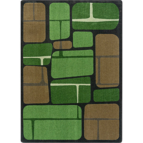 A close-up of a Joy Carpets Kid Essentials Meadow area rug with green and brown squares.