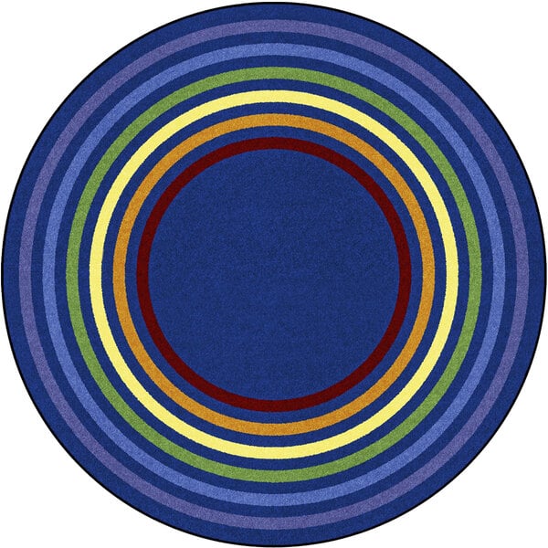A Joy Carpets multicolored circular area rug with rings of different colors.