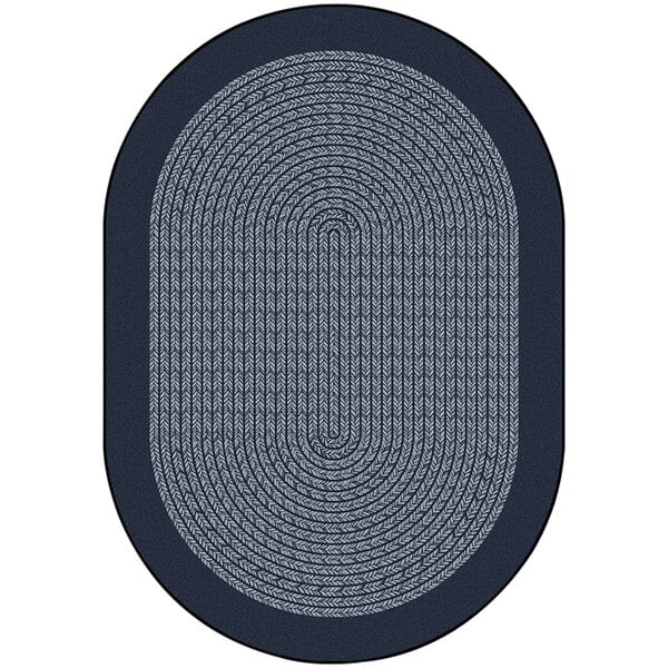 A white oval area rug with a navy braided border.