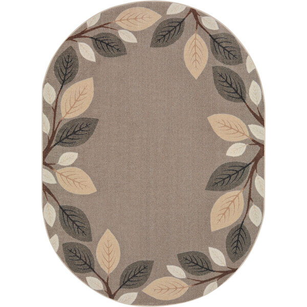 An oval neutral rug with leaves on it.