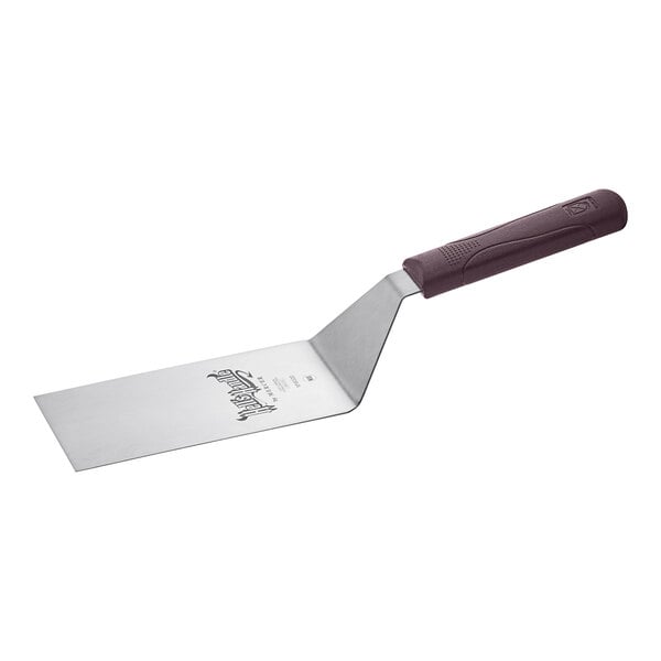 A Mercer Culinary Hell's Handle square edge turner with a brown handle.