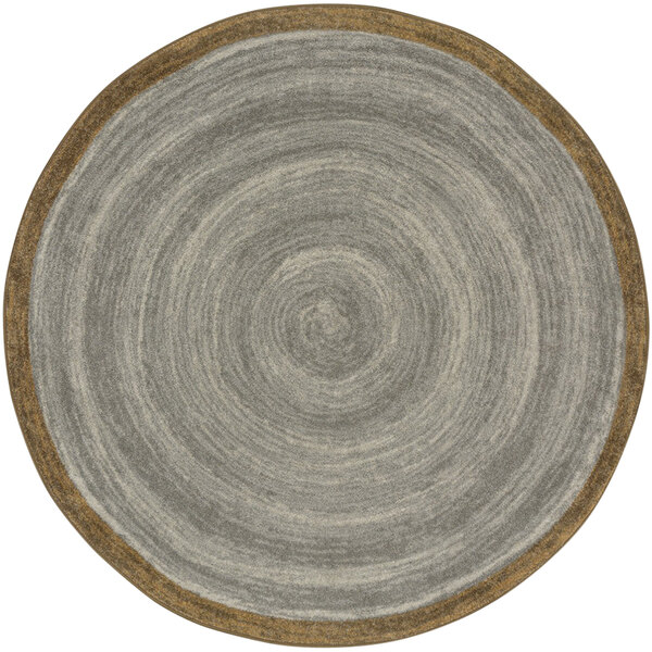 A Joy Carpets Feeling Natural stone round area rug with a brown circular border and gray and brown designs.