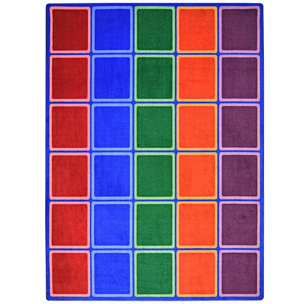 A colorful rectangular area rug with red and blue squares and blue lines.