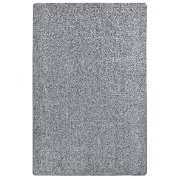 A close-up of a grey Joy Carpets Kid Essentials area rug with a white background.