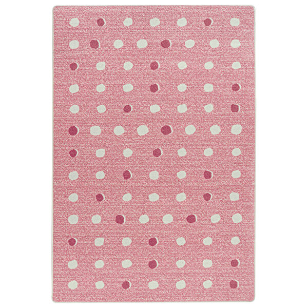 A blush pink and white rectangular rug with white dots.