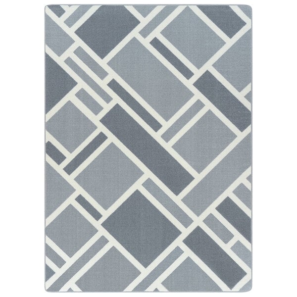 A close-up of the grey and white diamond pattern on a Joy Carpets rectangular area rug.