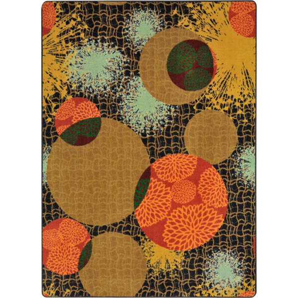 A close-up of a colorful Joy Carpets area rug with circles and dots in various colors.