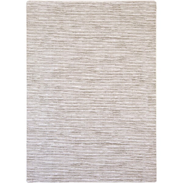 A white area rug with a beige and light gray pattern.