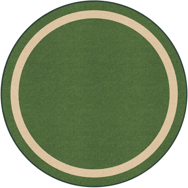 A round green area rug with a white border and green and tan accents.
