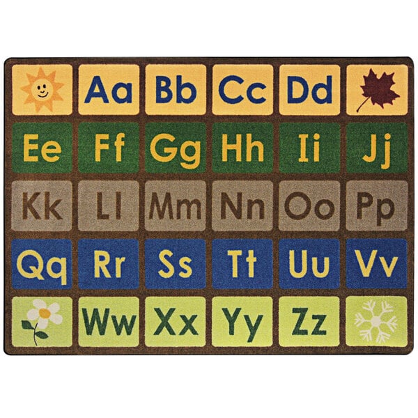 An earthtone rectangular area rug with a white background and colorful alphabet letters on it.