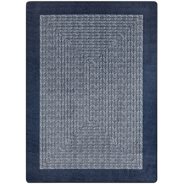 A navy blue and white rectangular area rug with a design