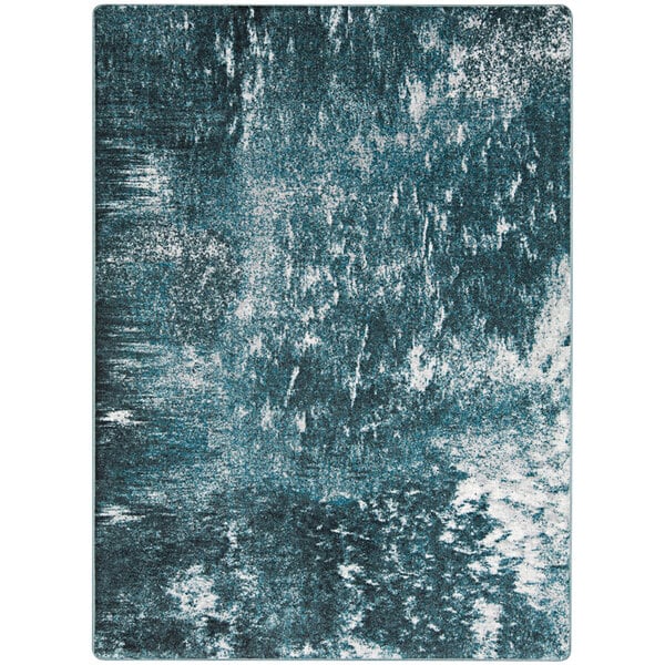 A Joy Carpets Riviera rectangular area rug with a blue and white watery effect.