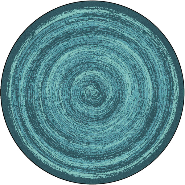 A teal circular rug with a spiral pattern.
