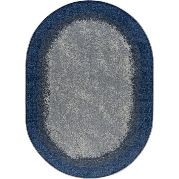 An oval marine blue rug with a blue border.