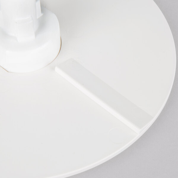 A white rectangular discharge plate for a Robot Coupe commercial food processor.