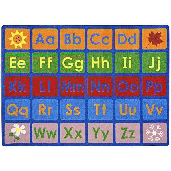 A white area rug with colorful letters and numbers in a rectangle.