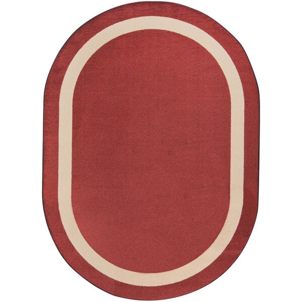 An oval wine red rug with a white border.