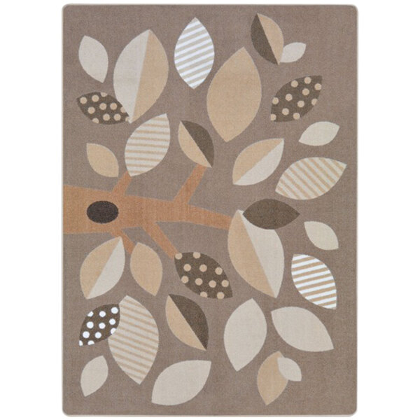 A neutral rectangular area rug with leaves and dots in brown and beige.