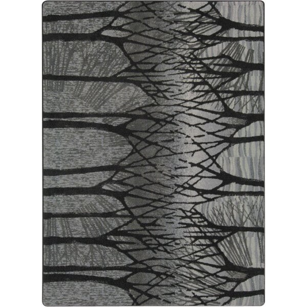 A Joy Carpets rectangular area rug with a gray and black tree pattern.