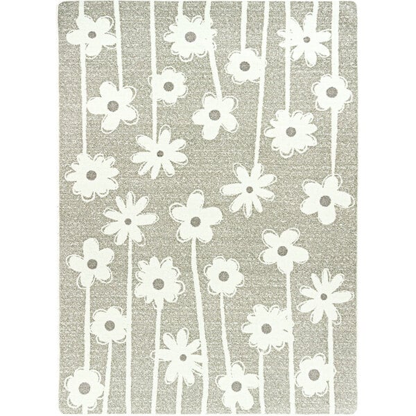 A linen rectangular area rug with grey and white flowers on it.