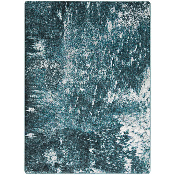 A close up of a blue and white Joy Carpets Riviera rectangular area rug with a watery effect.