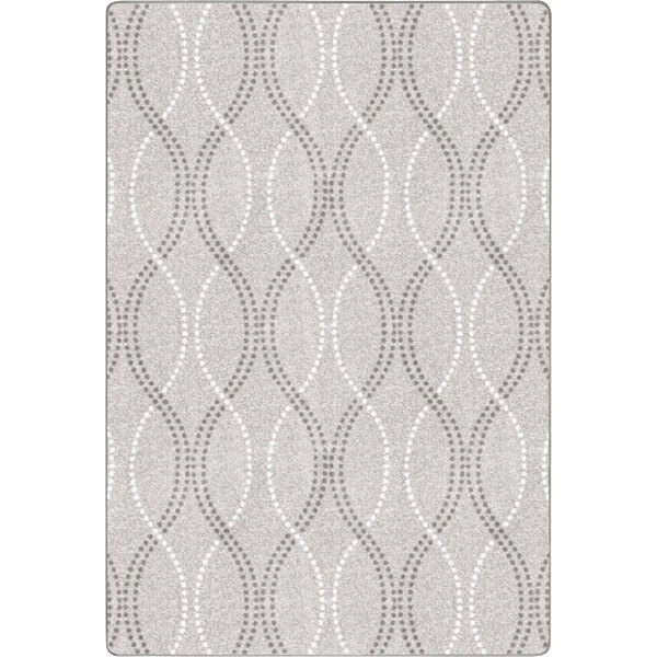 A close-up of a Joy Carpets Morning Fog area rug with a grey and white pattern.