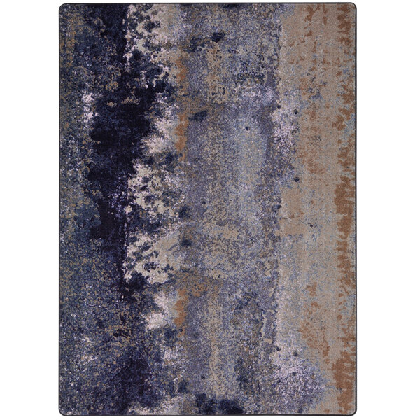 A close-up of a Joy Carpets First Take Amethyst area rug with blue and grey designs.