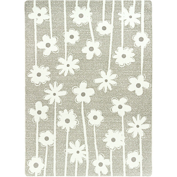 A linen area rug with grey and white big flowers on it.