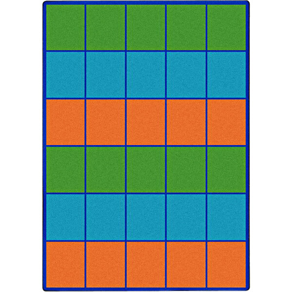 A multicolored rectangular area rug with green, blue, and orange squares in different colors.