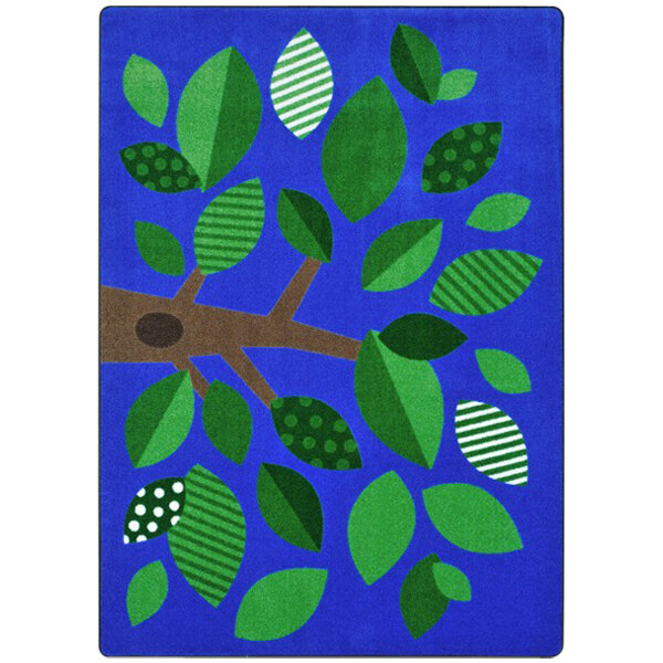 A multicolored rectangular area rug with blue trees and green leaves on it.