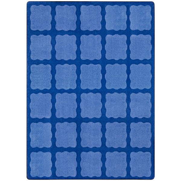 A blue rectangular area rug with white squares inside blue squares.