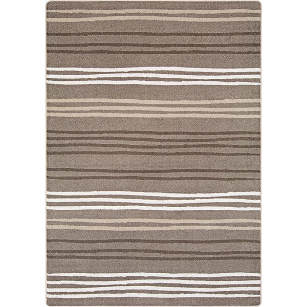 A close-up of a Joy Carpets area rug with white and brown stripes.