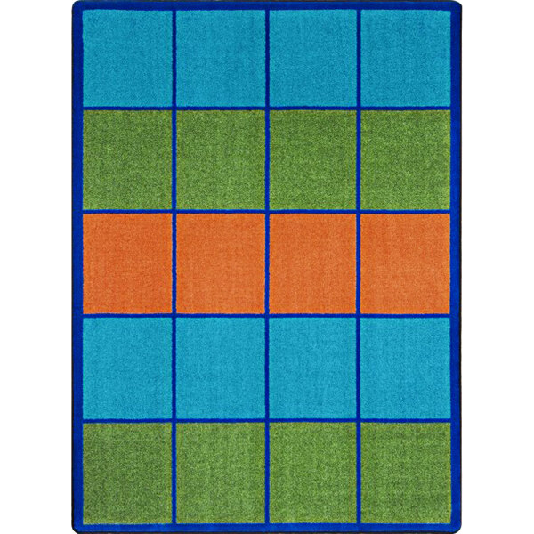 A Joy Carpets rectangular area rug with blue, orange, and green squares.