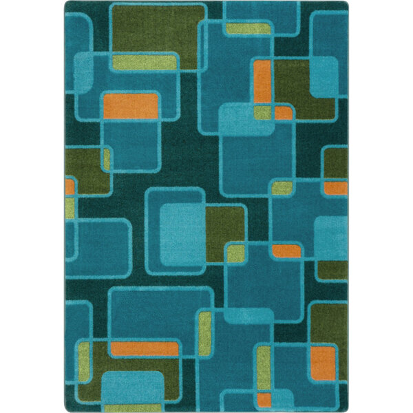 A blue and orange rectangular area rug with geometric shapes in green and blue.