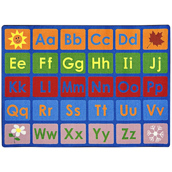 A white rectangular area rug with a colorful alphabet and numbers.