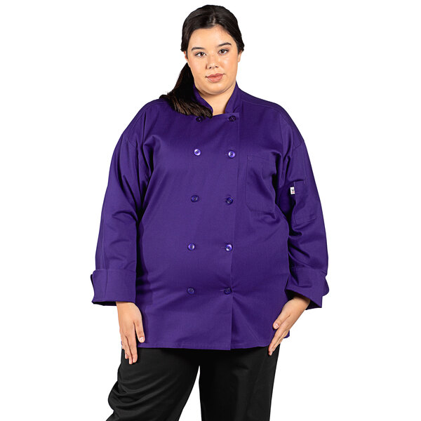 A woman wearing an Uncommon Chef Havana eggplant short sleeve chef coat with mesh back.