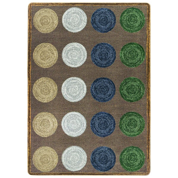 A multicolored rectangular area rug with circles in brown, green, and blue.